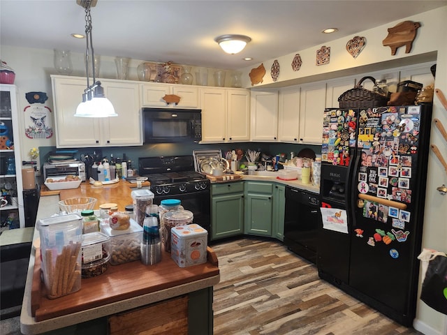 9-16 Bch 98th St, Rockaway Park, NY 11694 - kitchen with black appliances, green cabinetry, light wood-type flooring, white cabinets, and recessed lighting