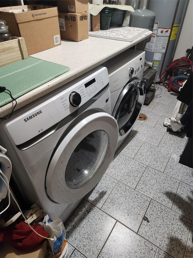 9-16 Bch 98th St, Rockaway Park, NY 11694 - laundry room with gas water heater and washer and clothes dryer