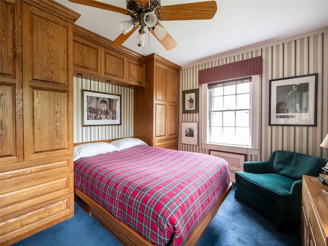 bedroom featuring carpet, wallpapered walls, and a ceiling fan