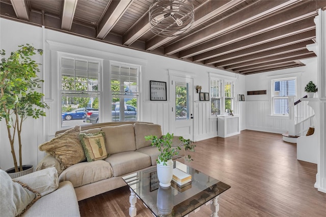 46 Mechanic St, Huntington, NY 11743 - living room with beam ceiling, wood finished floors, wainscoting, and a decorative wall