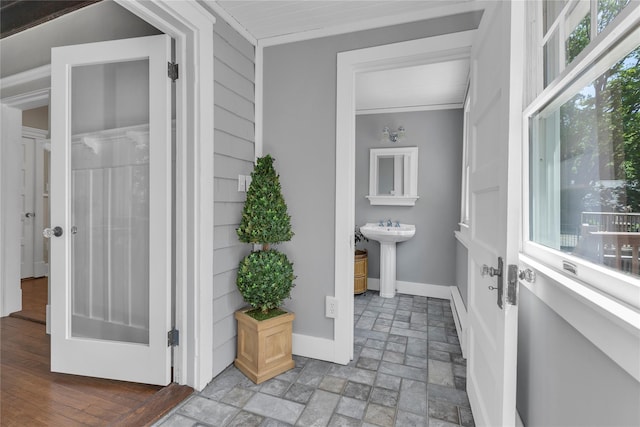 46 Mechanic St, Huntington, NY 11743 - bathroom featuring a sink, baseboards, and crown molding