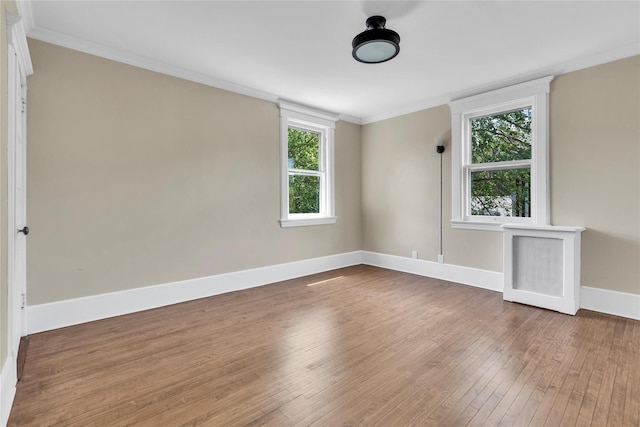 46 Mechanic St, Huntington, NY 11743 - spare room with baseboards, hardwood / wood-style flooring, and ornamental molding