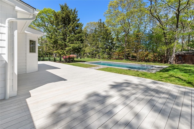 4 Pine Tree Ct, East Quogue, NY 11942 - wooden deck featuring an outdoor pool and a lawn