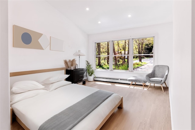 4 Pine Tree Ct, East Quogue, NY 11942 - bedroom with wood finished floors, recessed lighting, and a baseboard heating unit
