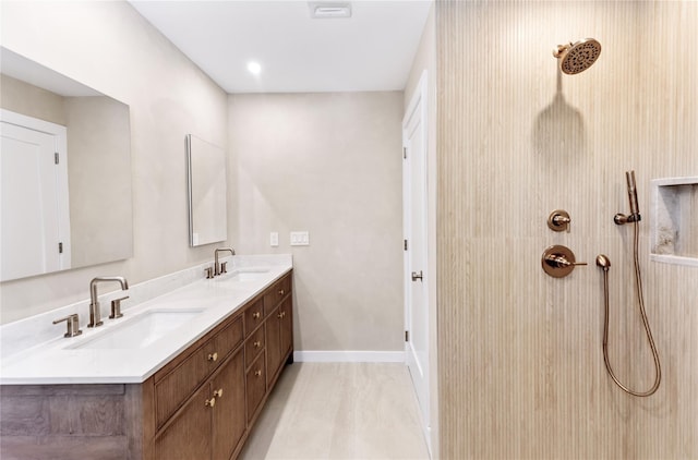 4 Pine Tree Ct, East Quogue, NY 11942 - full bath featuring double vanity, tiled shower, and baseboards