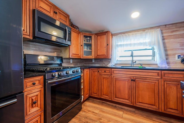 133B Edgewater Park Unit 133B, Bronx, NY 10465 - kitchen featuring stainless steel appliances, a sink, and brown cabinets