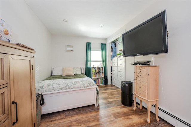 133B Edgewater Park Unit 133B, Bronx, NY 10465 - bedroom featuring wood finished floors and a baseboard radiator