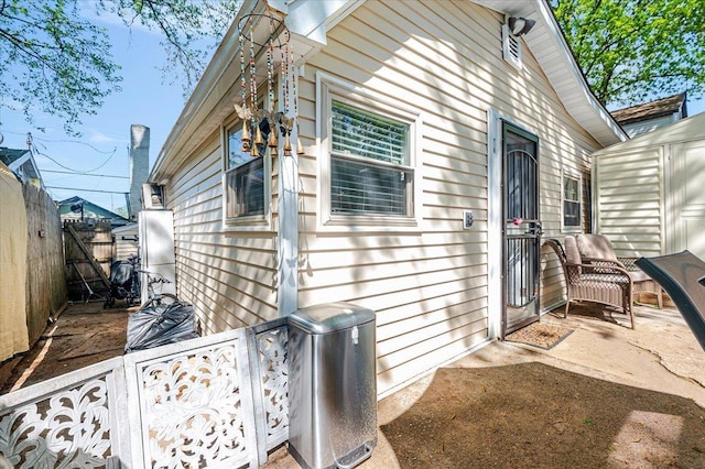 133B Edgewater Park Unit 133B, Bronx, NY 10465 - view of property exterior featuring fence, a storage unit, and an outbuilding