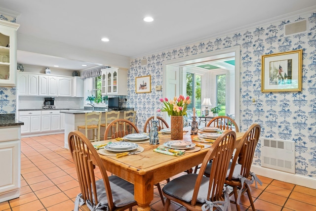 dining area featuring wallpapered walls, crown molding, light tile patterned floors, recessed lighting, and baseboards