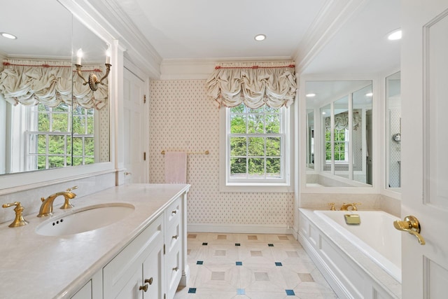 bathroom with crown molding, a garden tub, vanity, baseboards, and wallpapered walls