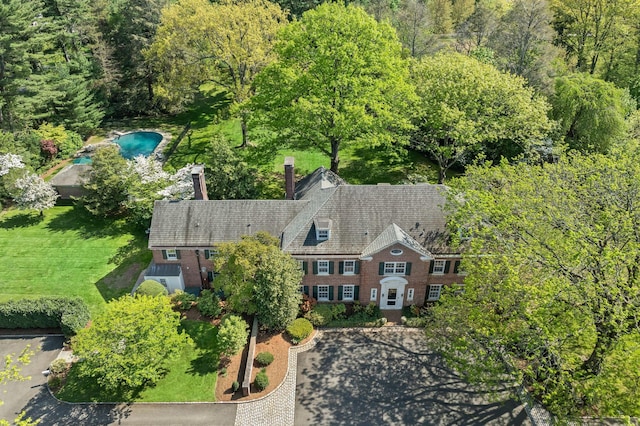 view from above of property featuring a forest