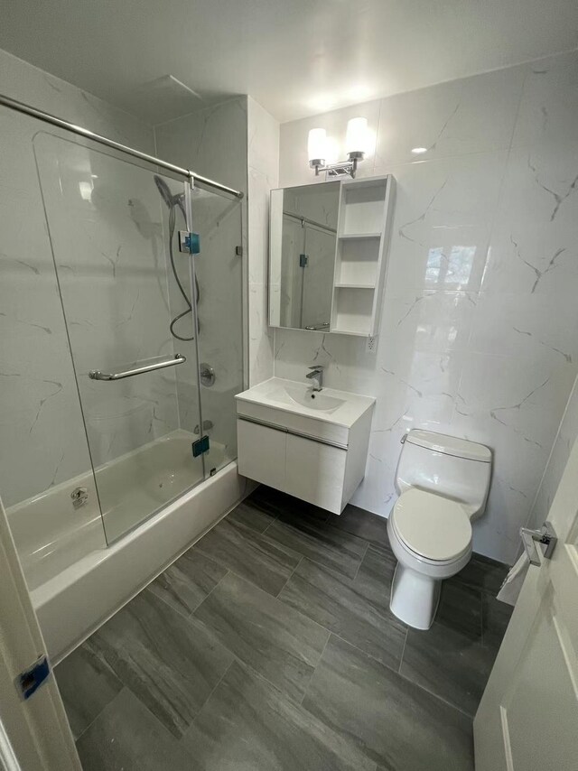 144-27 Sanford Ave Unit 6L, Flushing, NY 11355 - bathroom with toilet, washtub / shower combination, and vanity