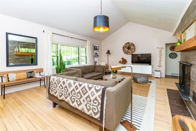 110 Sherwood Hill Rd, Brewster, NY 10509 - living room featuring wood-type flooring, lofted ceiling, and a fireplace with flush hearth