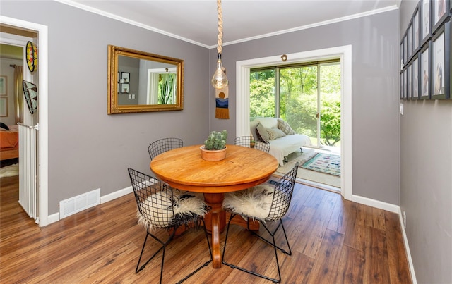 110 Sherwood Hill Rd, Brewster, NY 10509 - dining room with baseboards, wood finished floors, and crown molding