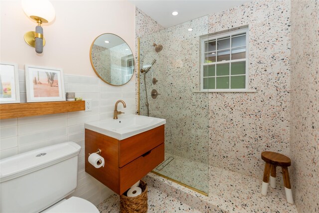110 Sherwood Hill Rd, Brewster, NY 10509 - bathroom with tile walls, toilet, walk in shower, and vanity