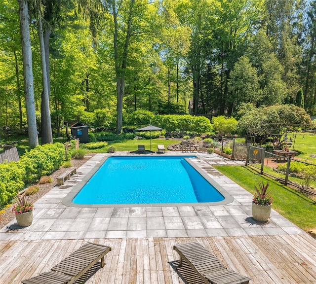 110 Sherwood Hill Rd, Brewster, NY 10509 - outdoor pool featuring a shed, an outbuilding, fence, and a patio area