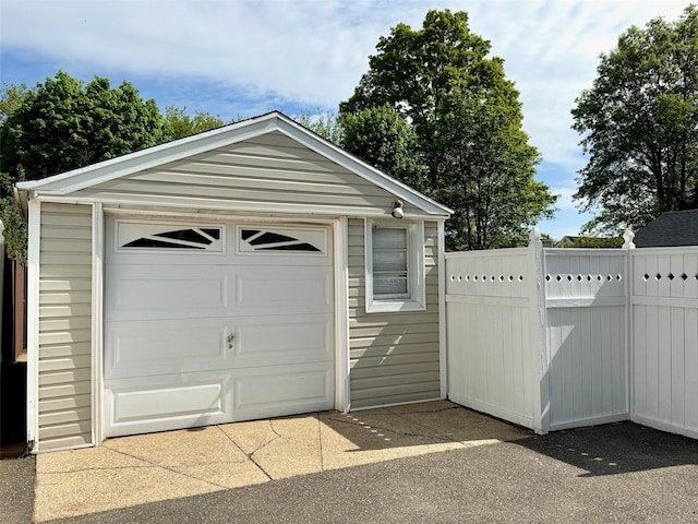detached garage with fence
