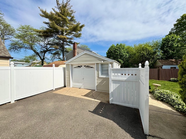 detached garage with fence