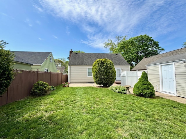 view of yard featuring a patio area and an outbuilding