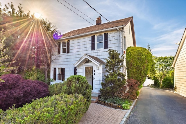 1730 Hancock St, Hewlett, NY 11557 - colonial-style house featuring a chimney
