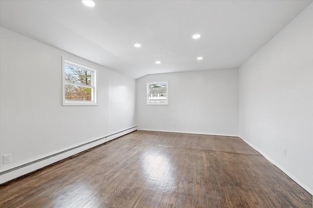 121 Arlington Ave, Wyandanch, NY 11798 - spare room with baseboard heating, wood finished floors, recessed lighting, vaulted ceiling, and baseboards