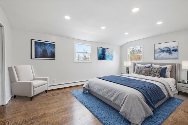 121 Arlington Ave, Wyandanch, NY 11798 - bedroom featuring a baseboard radiator, wood finished floors, recessed lighting, and vaulted ceiling