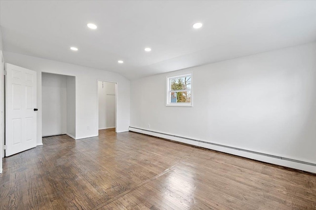 121 Arlington Ave, Wyandanch, NY 11798 - unfurnished room with wood finished floors, baseboard heating, recessed lighting, and baseboards
