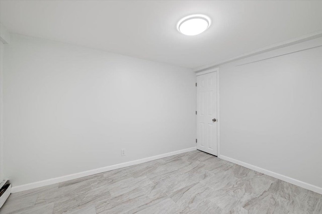 121 Arlington Ave, Wyandanch, NY 11798 - spare room with a baseboard radiator and baseboards