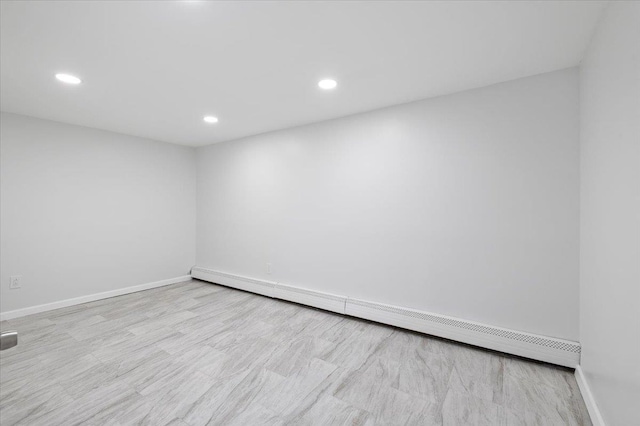 121 Arlington Ave, Wyandanch, NY 11798 - empty room featuring baseboard heating, baseboards, and recessed lighting
