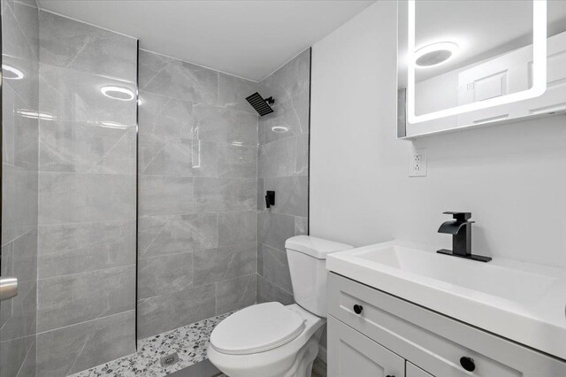 121 Arlington Ave, Wyandanch, NY 11798 - bathroom featuring walk in shower, toilet, and vanity