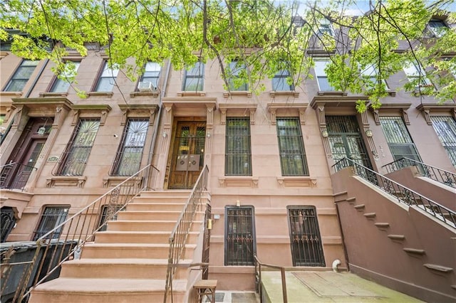 view of front of property with stairway