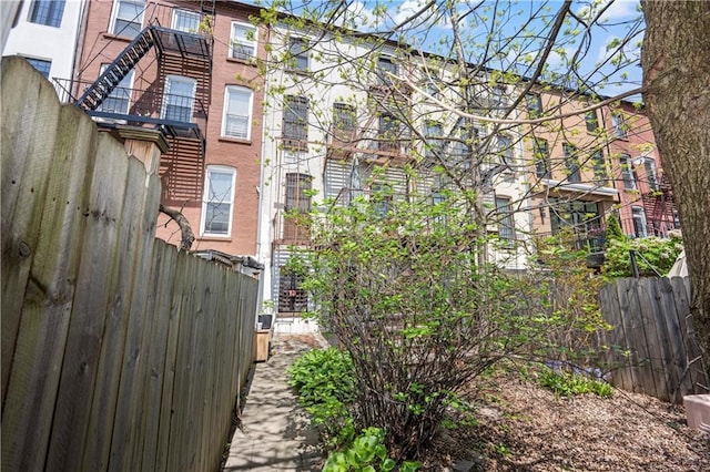 view of home's exterior featuring fence