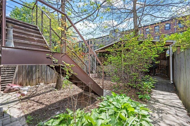 fenced backyard with stairs