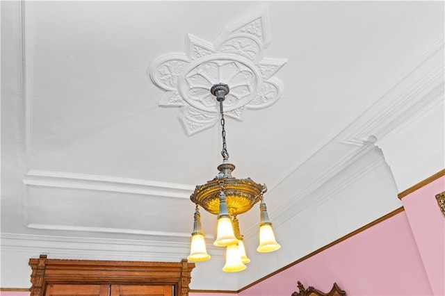 detailed view of a chandelier and ornamental molding