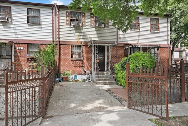 793 Jackson Ave, Bronx, NY 10456 - townhome / multi-family property featuring fence, cooling unit, and brick siding