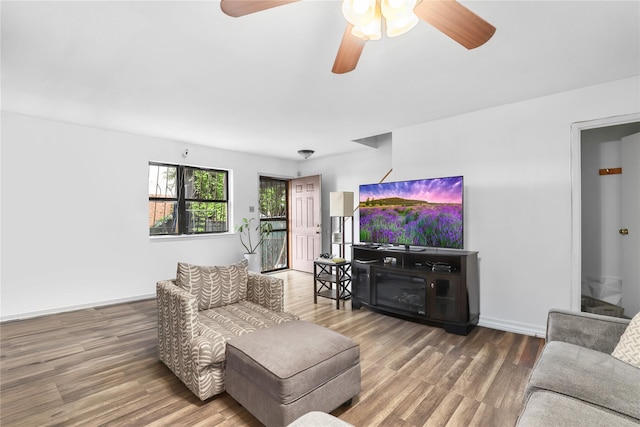 793 Jackson Ave, Bronx, NY 10456 - living area featuring wood finished floors, a ceiling fan, and baseboards