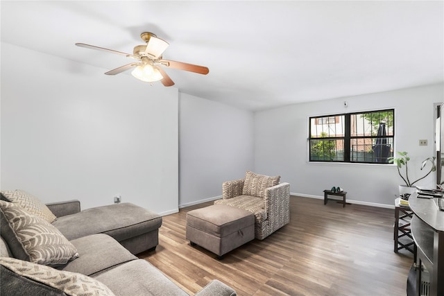 793 Jackson Ave, Bronx, NY 10456 - living room featuring wood finished floors, a ceiling fan, and baseboards