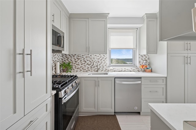 555 Kappock St Unit 20L, Bronx, NY 10463 - kitchen featuring appliances with stainless steel finishes, a sink, tasteful backsplash, and light countertops