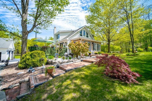 559 Noxon Rd, Poughkeepsie, NY 12603 - view of side of home featuring a lawn and a chimney