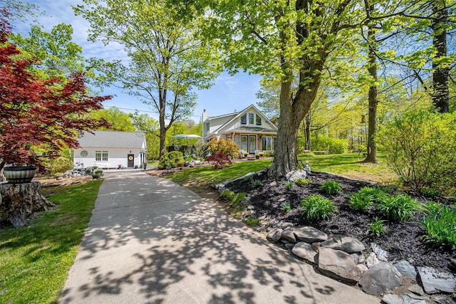559 Noxon Rd, Poughkeepsie, NY 12603 - view of front facade with a front lawn and concrete driveway