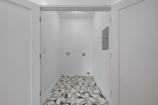 washroom with hookup for a washing machine, electric panel, baseboards, and light floors