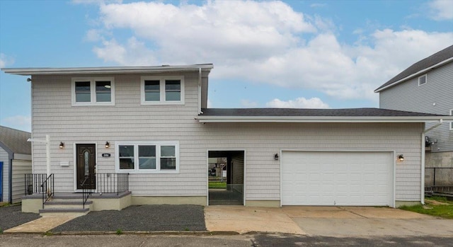 886 S 8th St, Lindenhurst, NY 11757 - view of front facade with an attached garage and concrete driveway