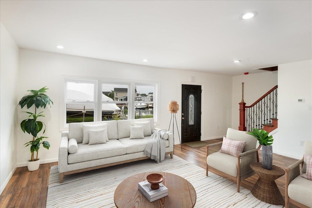 886 S 8th St, Lindenhurst, NY 11757 - living room with light wood-style flooring, stairs, recessed lighting, and baseboards