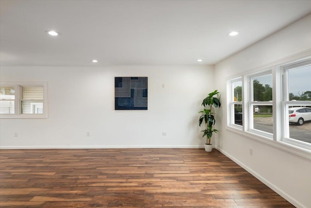 886 S 8th St, Lindenhurst, NY 11757 - empty room featuring wood finished floors, recessed lighting, and baseboards
