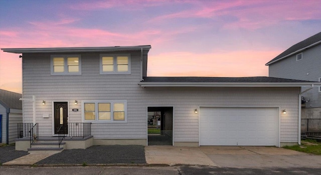 886 S 8th St, Lindenhurst, NY 11757 - view of front of property with concrete driveway and a garage