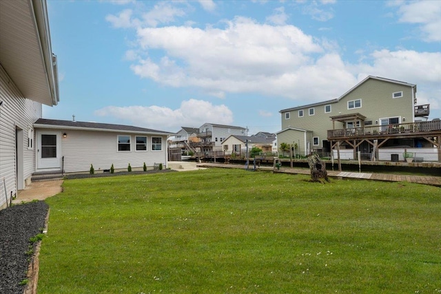 886 S 8th St, Lindenhurst, NY 11757 - view of green lawn with entry steps and a residential view