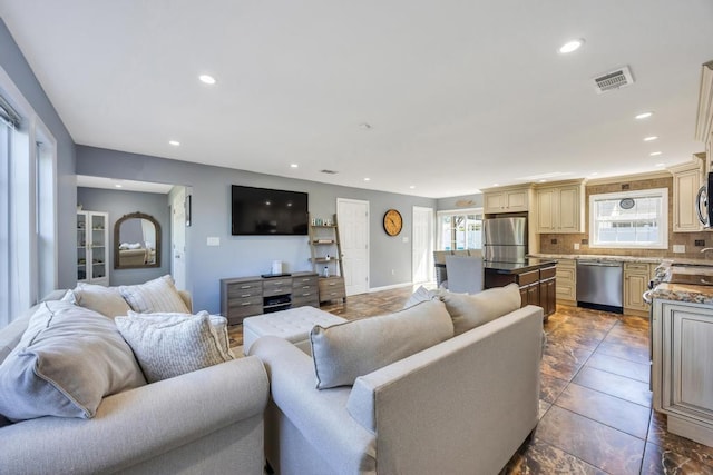 59 Saddle Ln, Levittown, NY 11756 - living room with recessed lighting and light tile patterned flooring