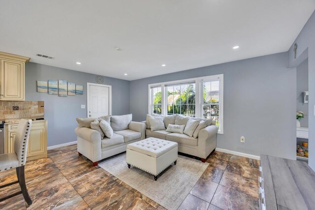 59 Saddle Ln, Levittown, NY 11756 - living room with baseboards and recessed lighting
