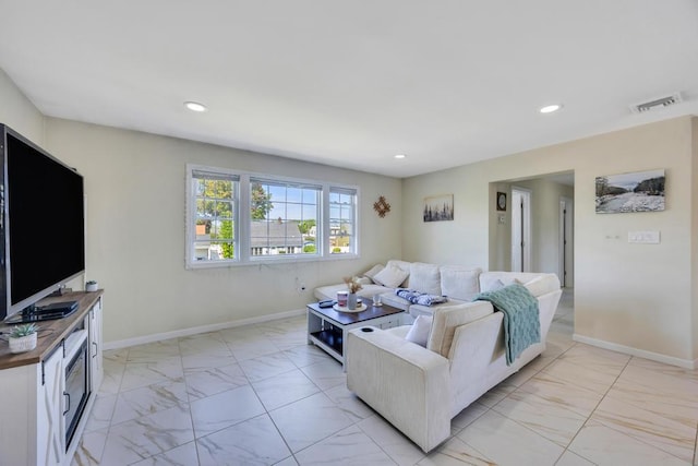 59 Saddle Ln, Levittown, NY 11756 - living room featuring light marble finish floors, baseboards, and recessed lighting
