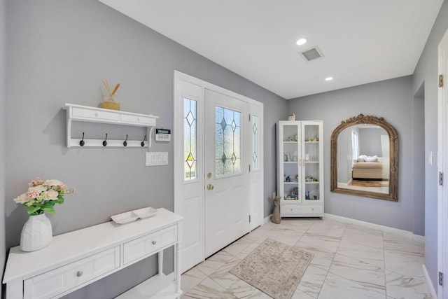 59 Saddle Ln, Levittown, NY 11756 - mudroom with light marble finish floors, recessed lighting, and baseboards